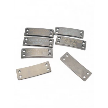 4-hole slightly curved sew-on label 21.5 mm x 7 mm E 1587