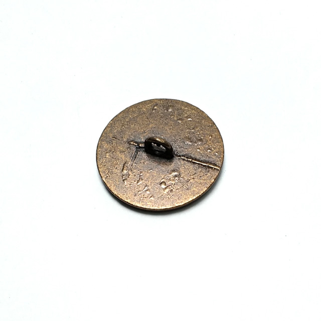 Patterned round leg button 25 mm E 187